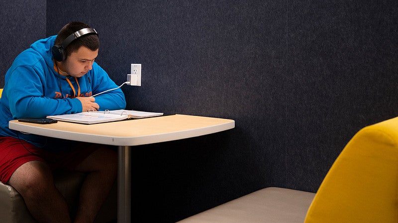 a student studies in the Allen Hall Experience Hub