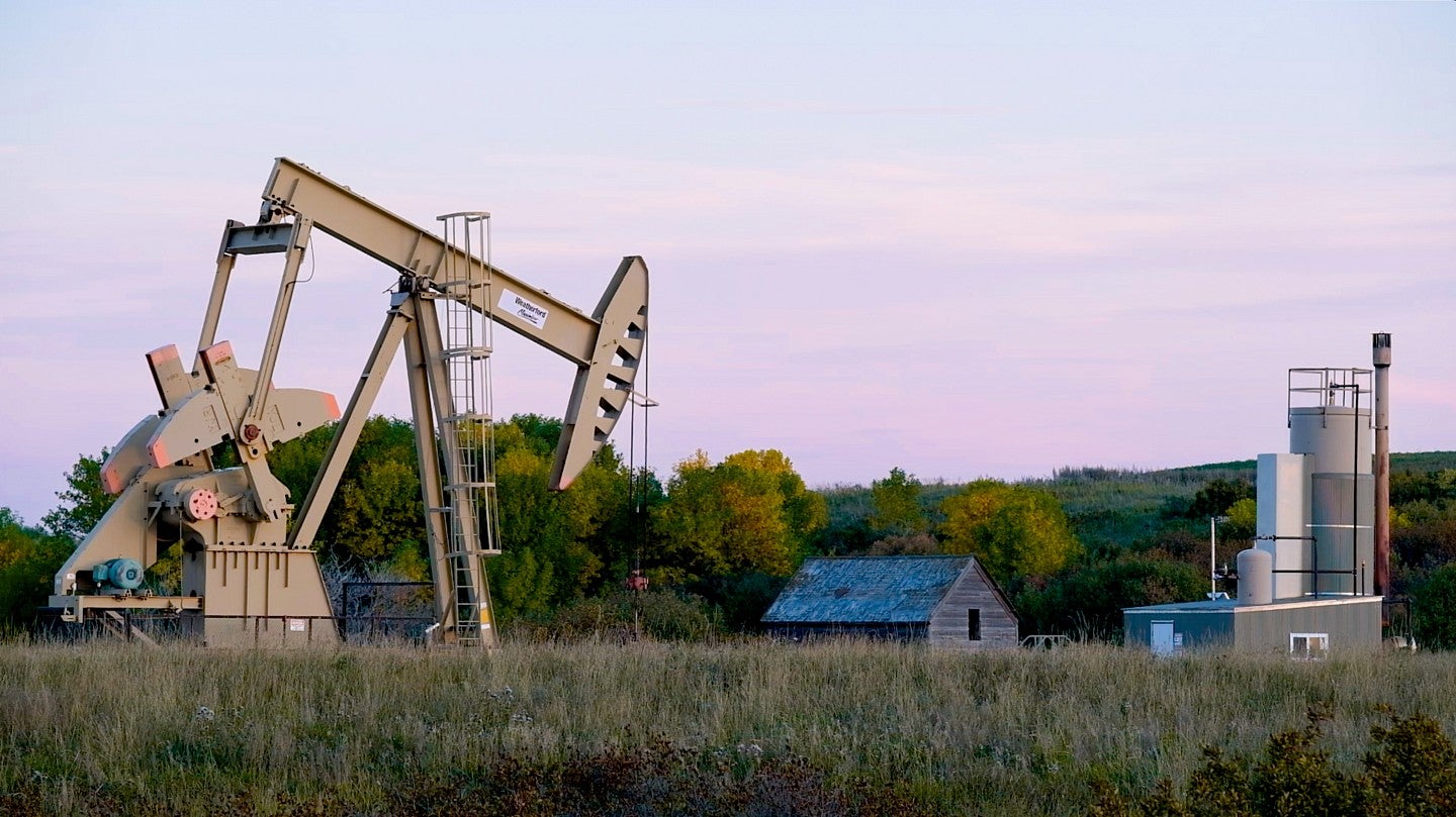 an oil rig set in a North Dakota farm field