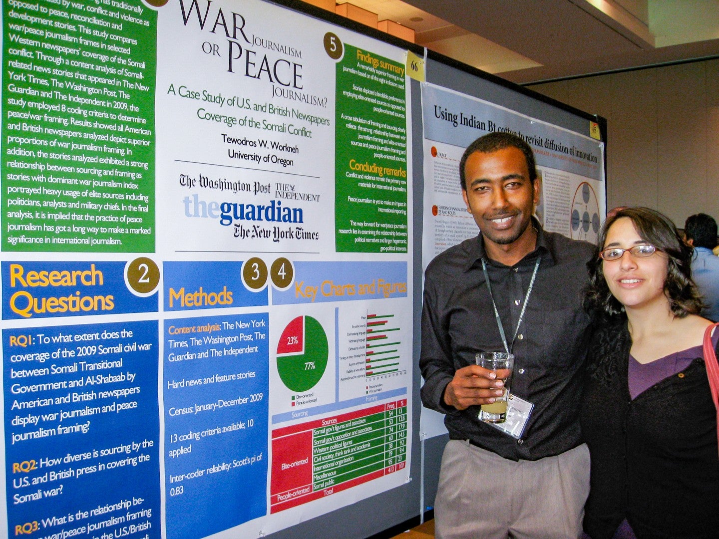 Teddy Workneh and another student pose in front of Teddy's research poster