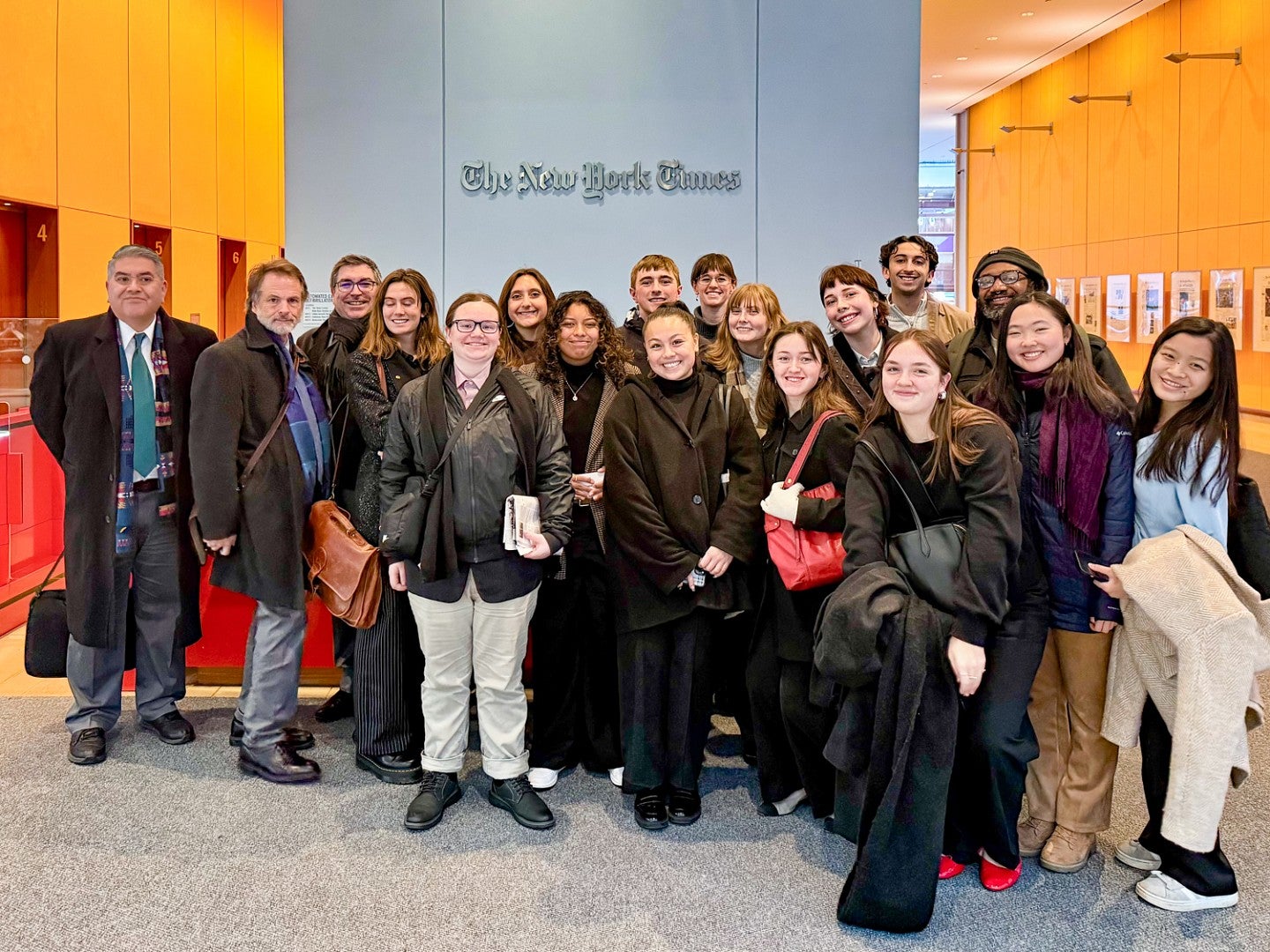 group photo of SOJC students and faculty posing at The New York Times