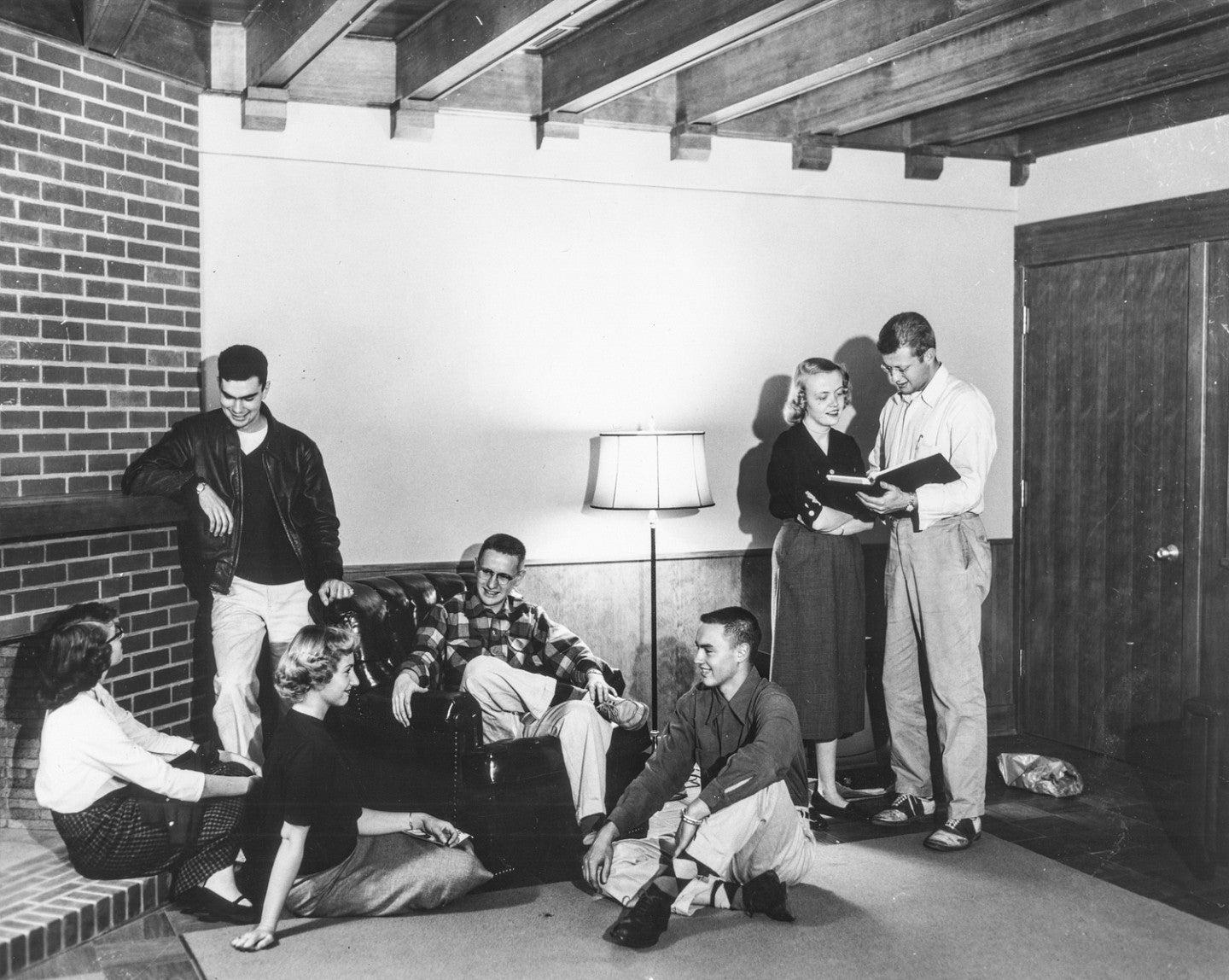 black and white photo from 1954 showing students chatting in the Allen Room