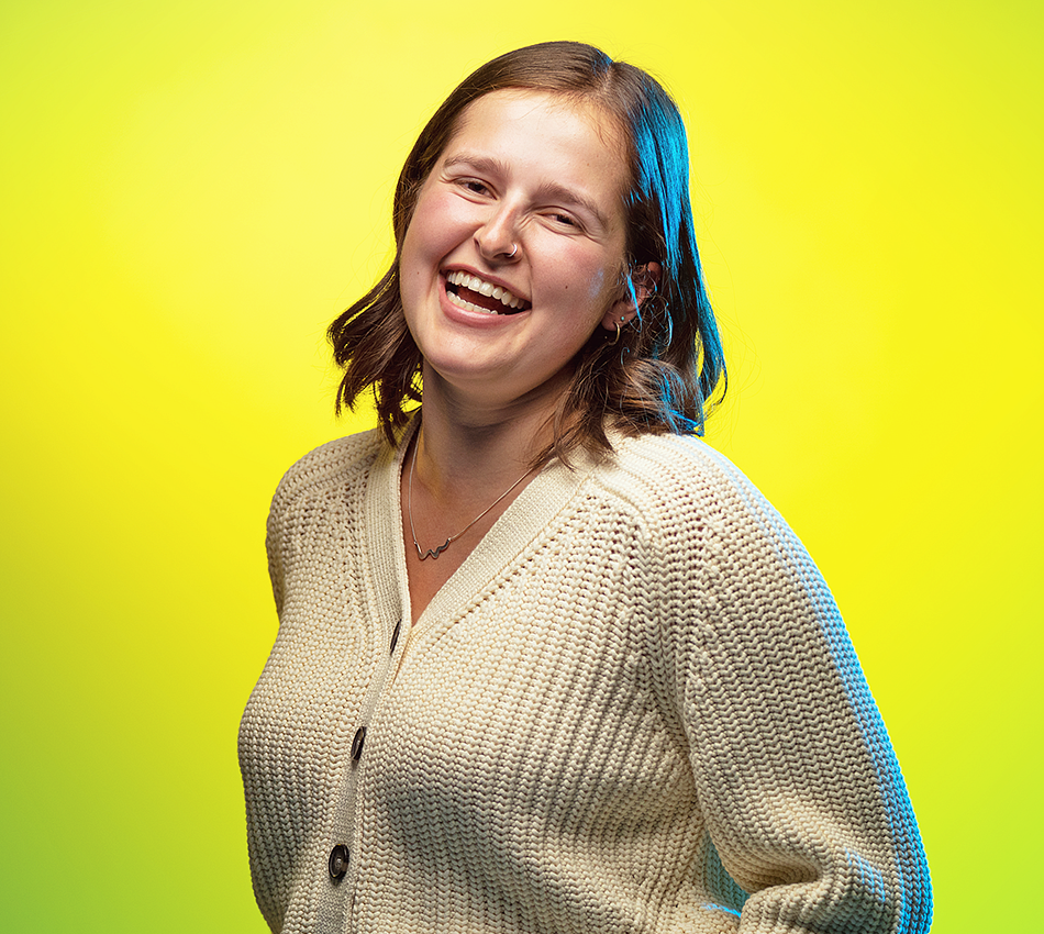 portrait of Eliza Lawrence on a vivid yellow background