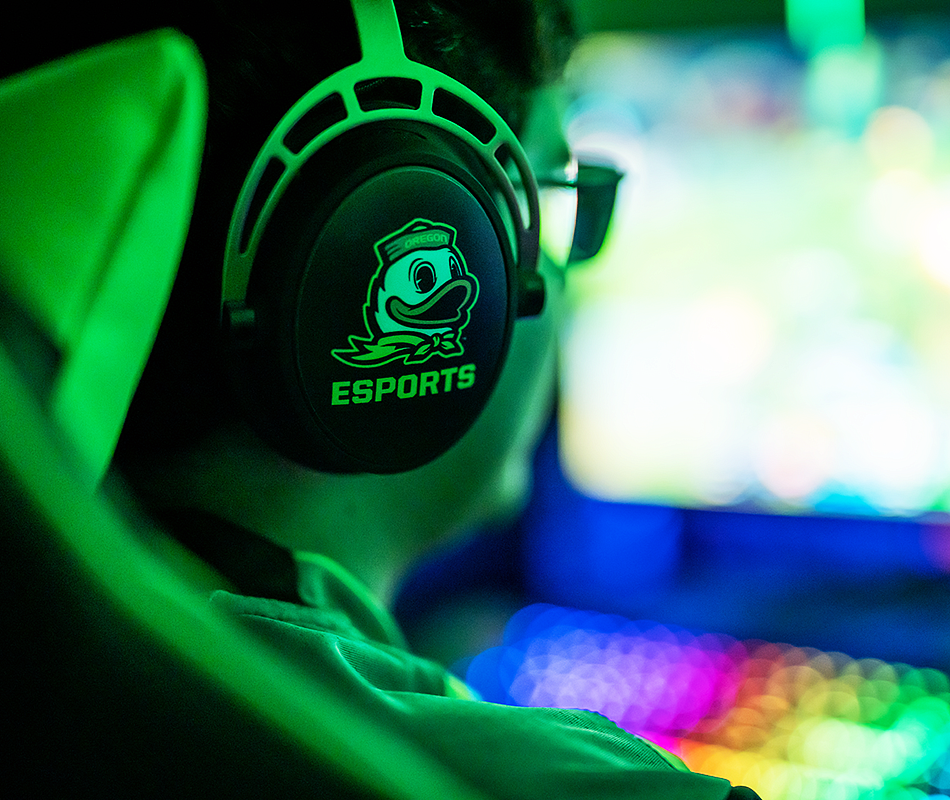 Person playing esports wearing headphones with a duck logo