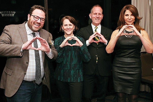 A group throwing the O at the Hall of Achievement dinner