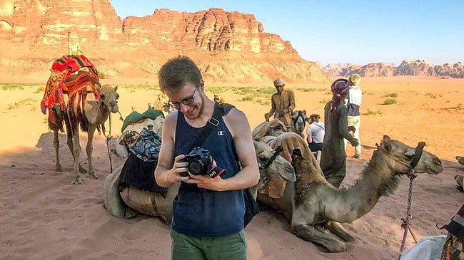 Payton Bruni prepares his gear for a camel trip to a Bedouin campsite in the Wadi Rum desert