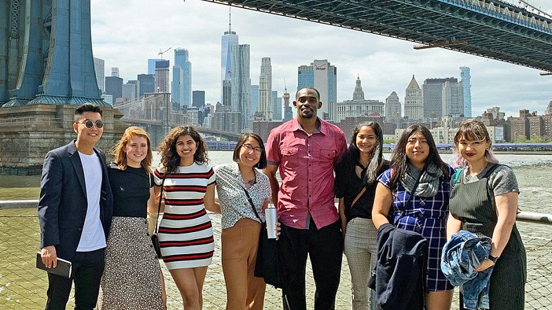 SOJC Advertising students pose with the New York City skyline in the background