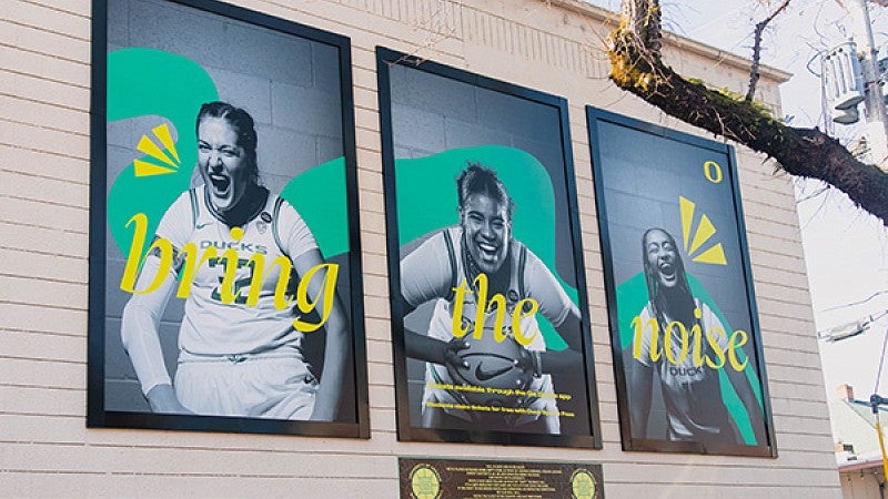 large posters featuring members of the 2021-22 UO Women's Basketball team, designed by Allen Hall Advertising Agency