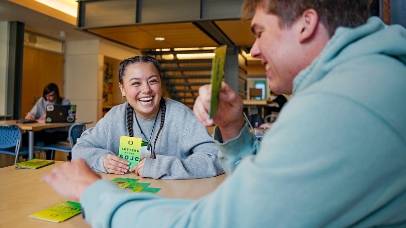 Sydney Seymour and a friend play SOJC Letters, a game she created for her Media Studies production class