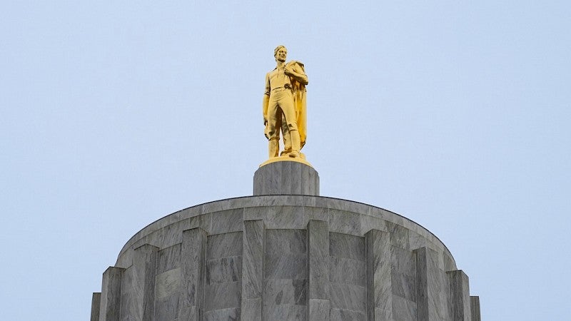Statue at the top of the Oregon State Capitol Building