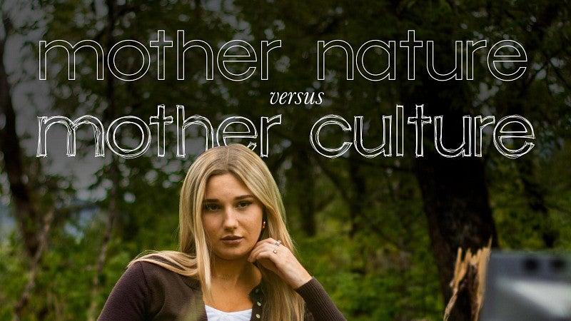 cover of Mother Nature Versus Mother Culture magazine with a woman posing in a chair in a grassy field