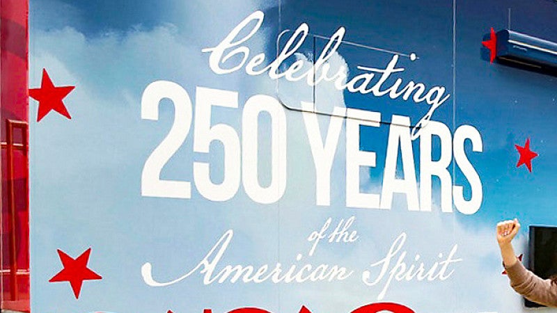 decal on the side of a truck that says "Celebrating 250 Years of the American Spirit"