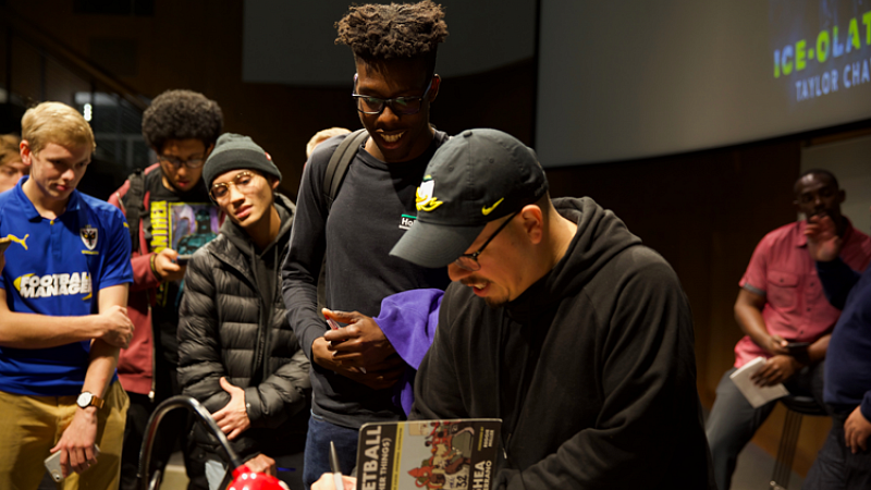 Shea Serrano shares the stage with a panel of SOJC students.