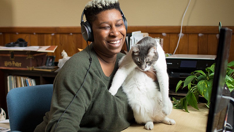 Tiara Darnell and her cat in front of a computer