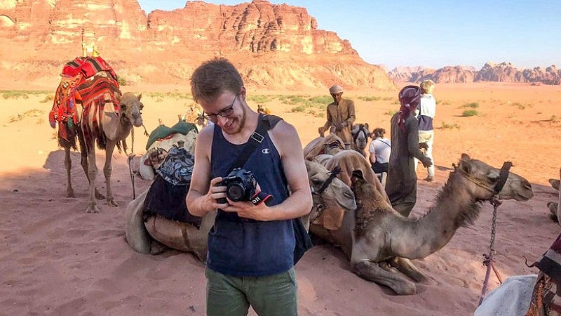Payton Bruni prepares his gear for a camel trip to a Bedouin campsite in the Wadi Rum desert. Bruni visited Jordan in the summer of 2018 with the Global Education Oregon (GEO) study-abroad program. Payton Bruni prepares his gear for a camel trip to a Bedouin campsite in the Wadi Rum desert.