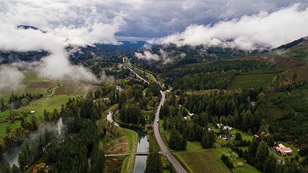 Overhead photo of a river and a road