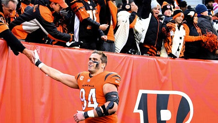 A football player high-fives a fan.