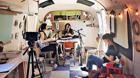 multimedia journalism students record audio in an airstream trailer