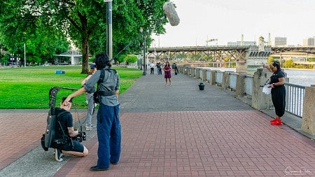 Sommer Martin's team films a movie beside the Willamette River in downtown Portland, Oregon