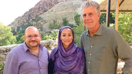 Jason Rezaian and his wife Yeganeh Salehi pose with Anthony Bourdain