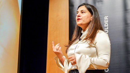 Saima Kazmi speaks at an event