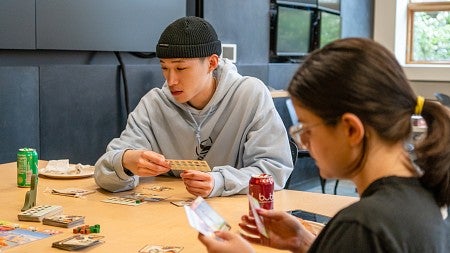 SOJC students play a tabletop game at science communication game night