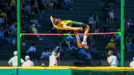 Jack Jensen completes a high jump during a University of Oregon track meet