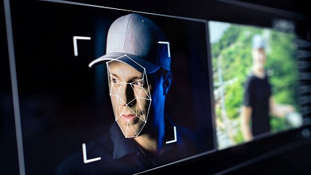 stock image showing digital face-mapping lines superimposed over a man's face