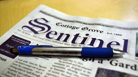 A blue pen on top of a copy of a Cottage Grove Sentinel newspaper (by Chantelle Meyer For The Sentinel).