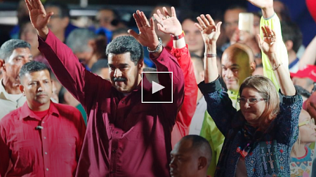 Venezuela's president Nicolas Maduro and his wife Cilia Flores wave to Supporters.