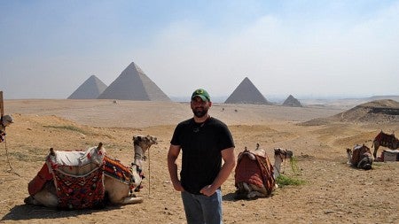 Matt stands near the Pyramids of Giza in Egypt
