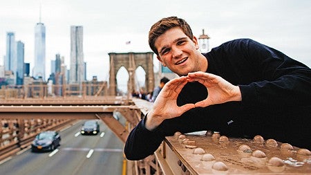 A student throwing the O in New York City