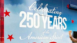 decal on the side of a truck that says "Celebrating 250 Years of the American Spirit"