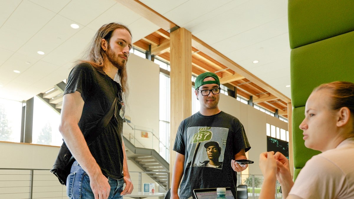 Bart Brewer and Armando Ramirez interview a student in the Erb Memorial Union