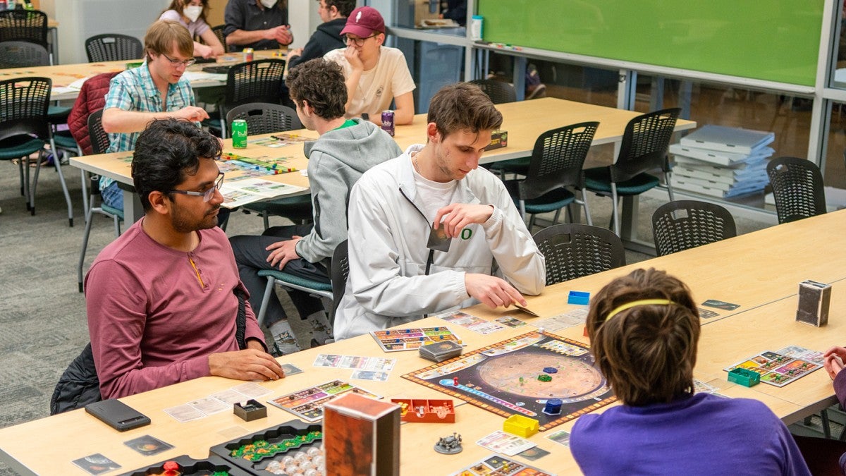 people playing tabletop strategy games