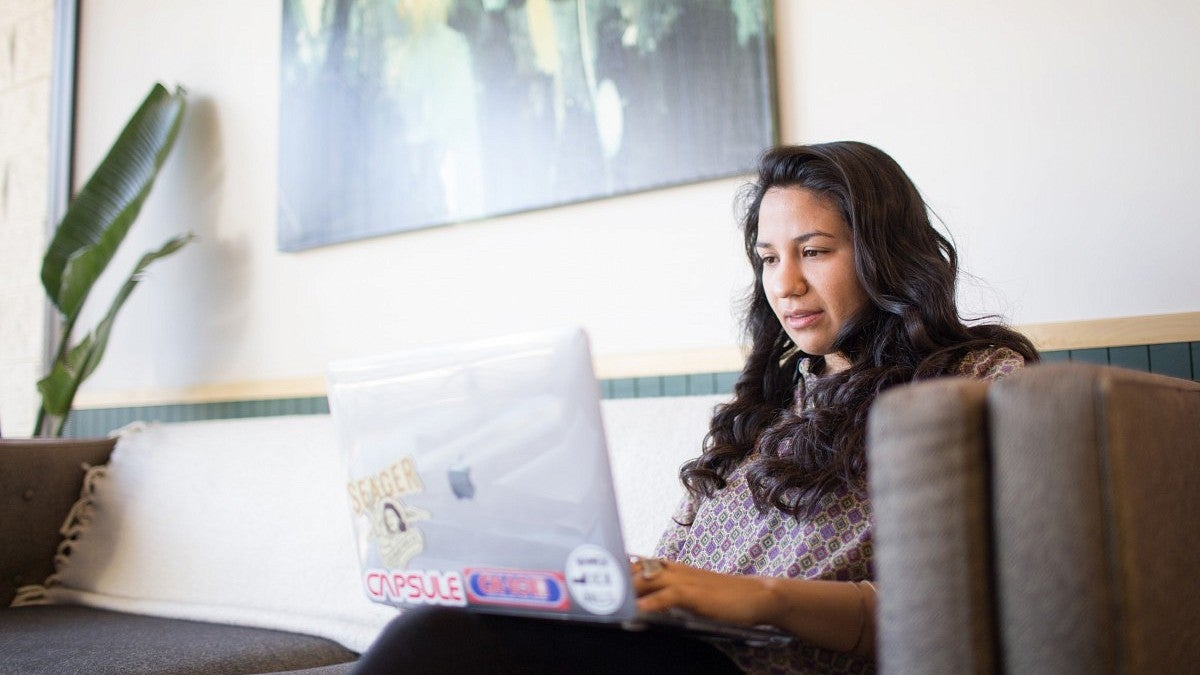 Jackie Gutierrez Jackie Gutierrez works on a laptop in an indoor setting