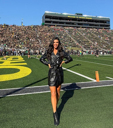Bri Amaranthus on the sideline of a University of Oregon football game