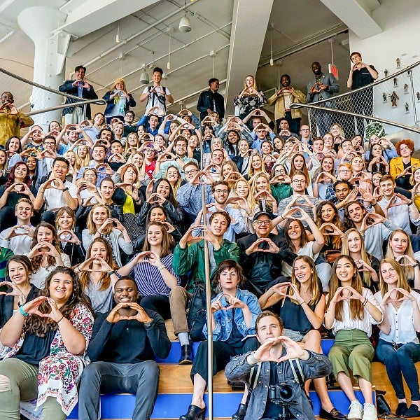 dozens of SOJC advertising students and faculty throw their Os on the steps of Wieden Kennedy in New York