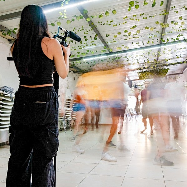 Lizzy Lee films a group of dancers that have been captured as a blur of motion