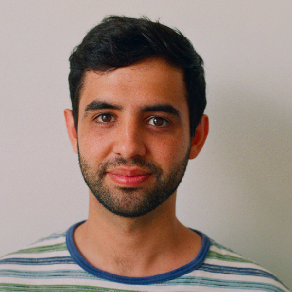 Brandt Hamilton, wearing a green and blue stripped shirt, smiles at the camera. Brandt Hamilton, wearing a green and blue stripped shirt, smiles at the camera.