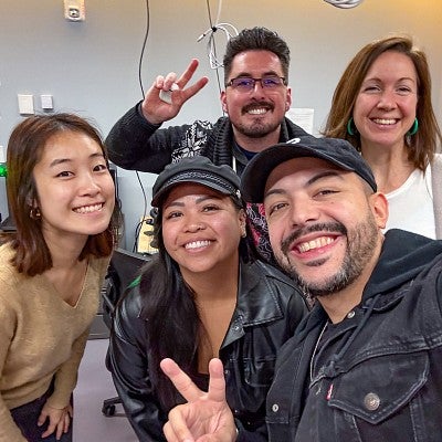 four graduate student members of the Snap AR Scholars program pose with professor Danny Pimentel