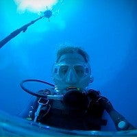 Forrest Brennan underwater wearing scuba diving gear