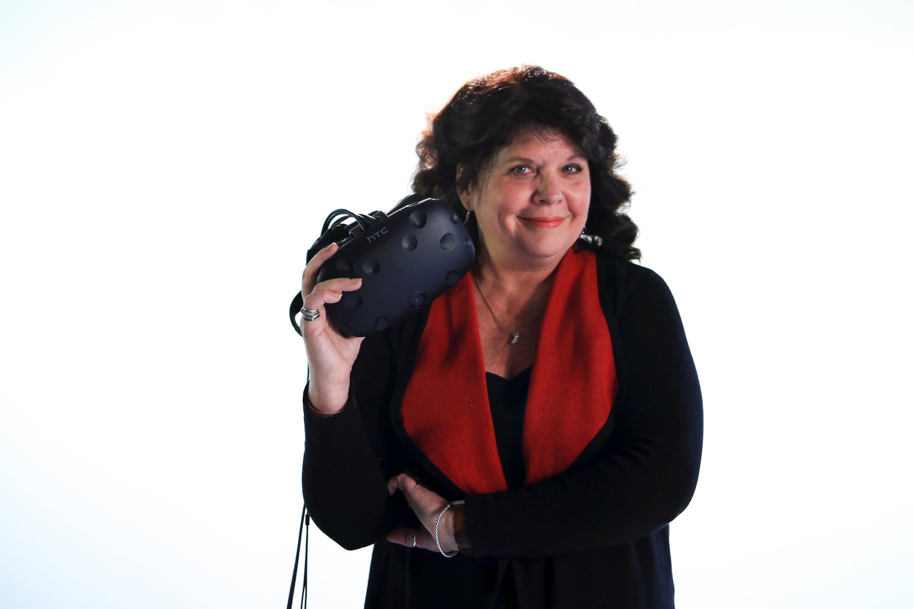 Donna Davis holds a VR headset.