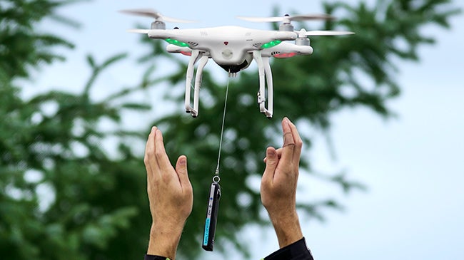 A drone lifting off from a person&#039;s hands