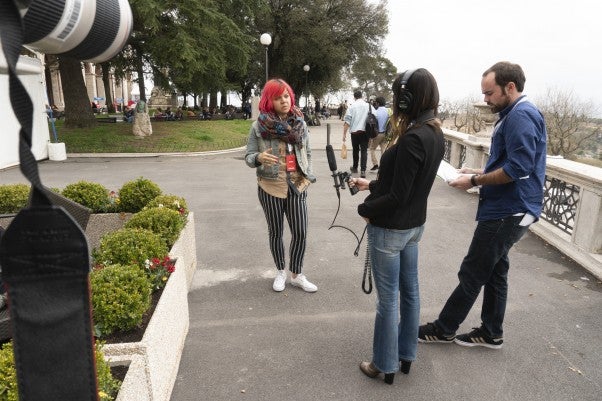 University of Oregon School of Journalism and Communication Multimedia Journalism students Patty Torchia (middle) and Jack Fisher interview Andrea Hart, Co-founder of City Bureau, for the Listeners Podcast, in Perugia, Italy during the International Journalism Festival.