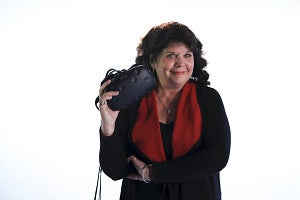 Donna Davis holds a VR headset.