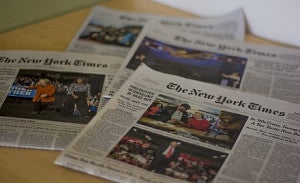 a stack of New York Times newspapers