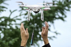 Two hands releasing a drone. Two hands releasing a drone.