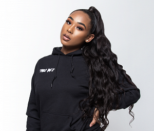 Minyon Moore Minyon Moore with a long ponytail in a black hoodie