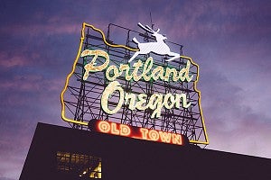 Portland Oregon sign on top of the White Stag Block