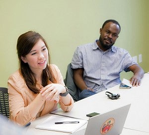Two students sitting together during class